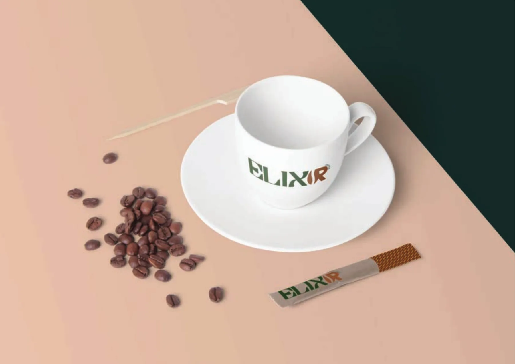 Espresso cup with the Elixir logo beside coffee beans and a branded sugar stick