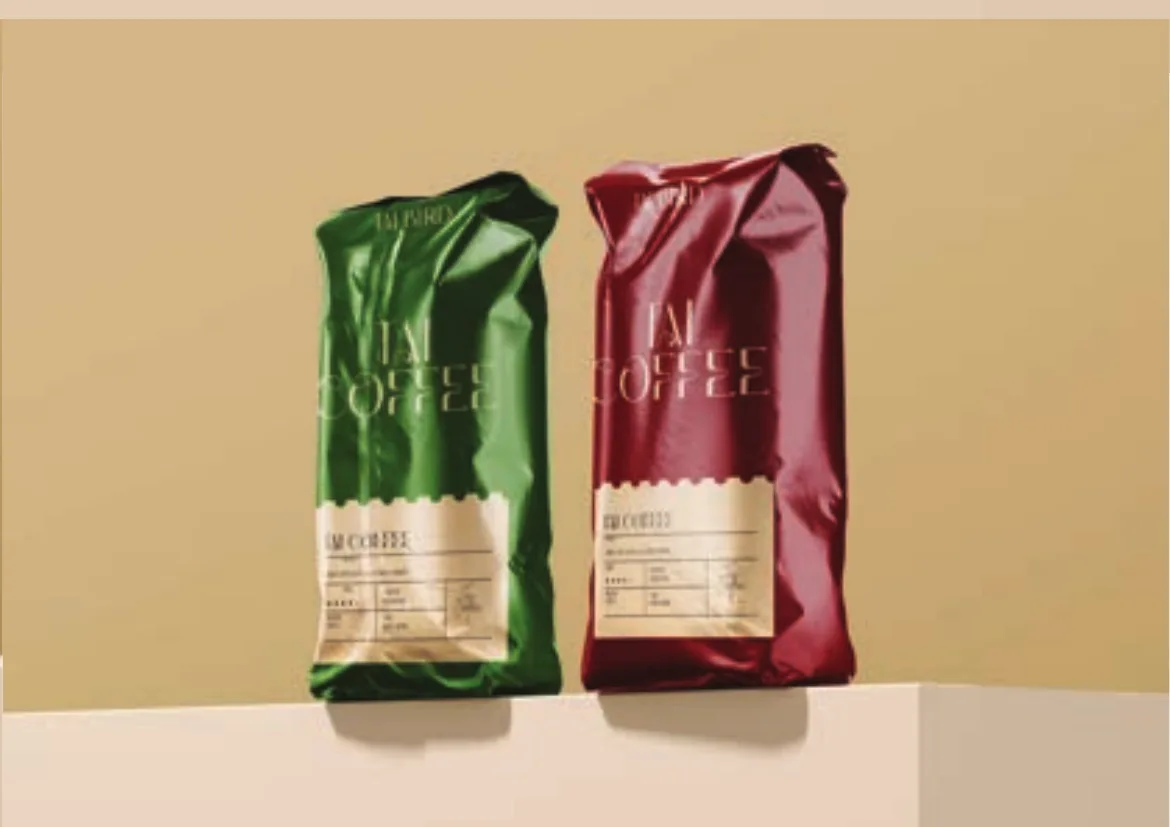 Green and crimson Tai Coffee bags side by side